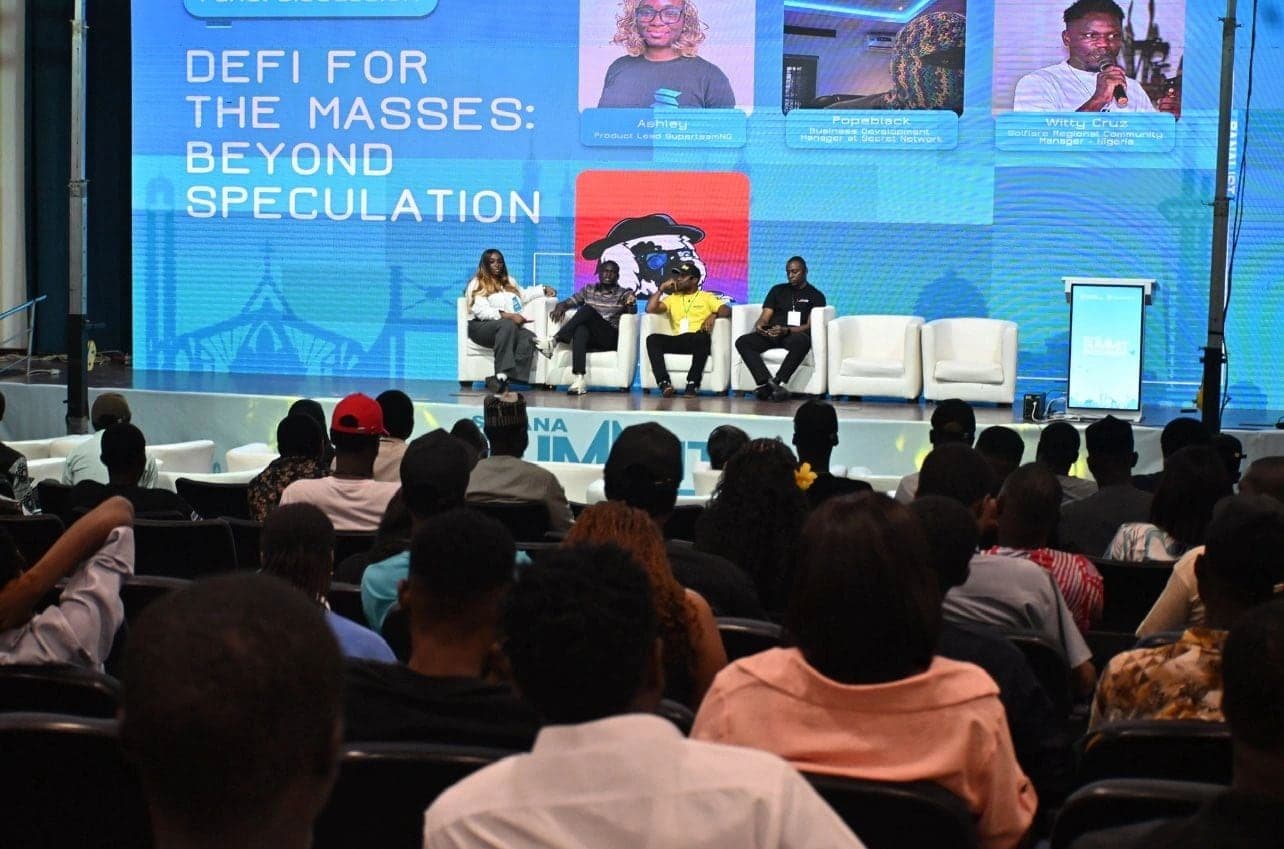 Kayode Popoola speaking on a DeFi panel in front of an African Web3 conference audience.